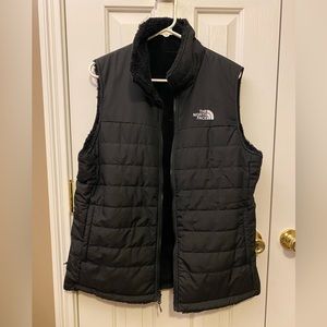 Women’s The North Face Reversible black nylon/fuzzy vest, size XL